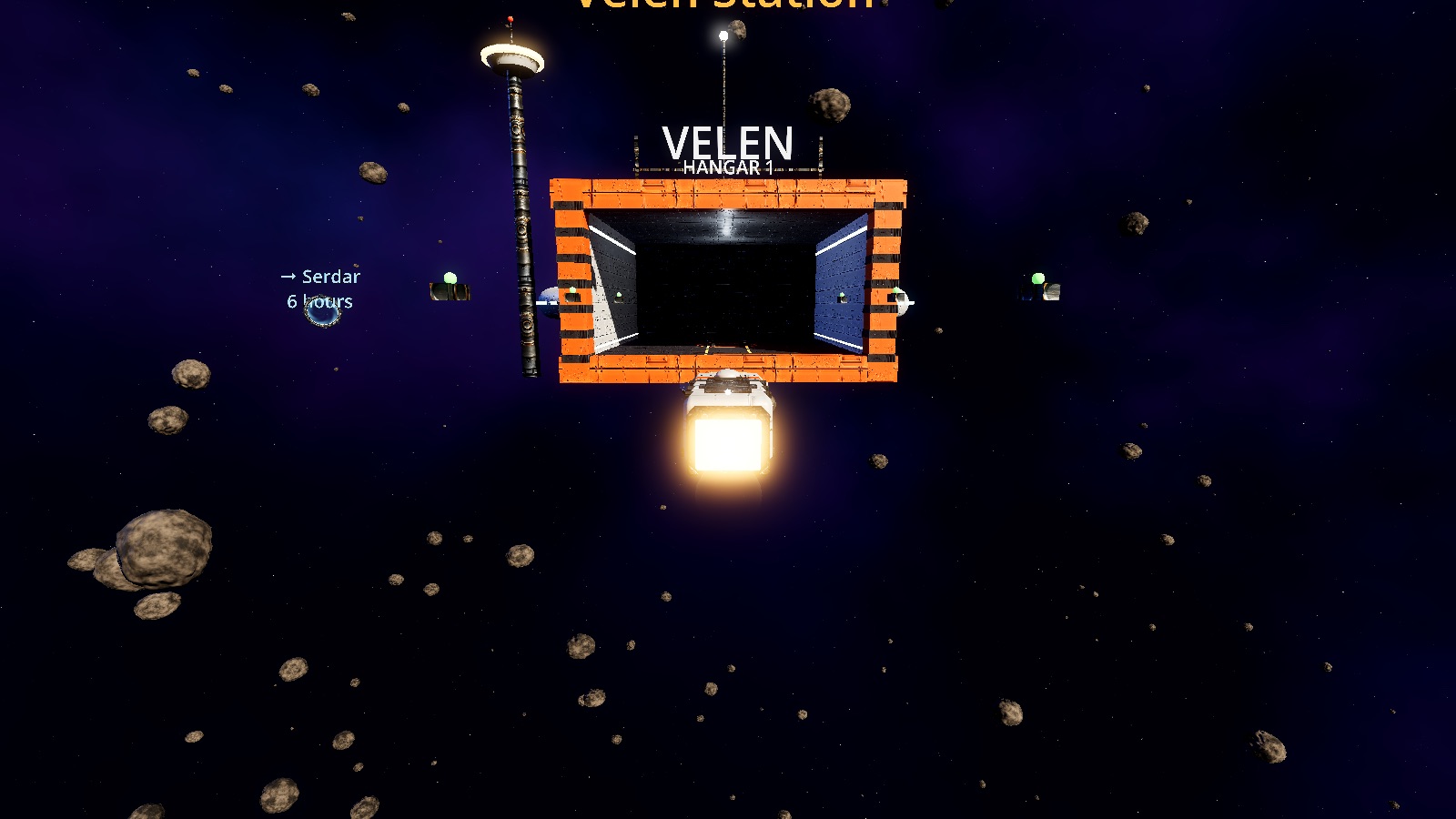 Approaching Velen Station. Every station has its own control tower, sign and colours.
